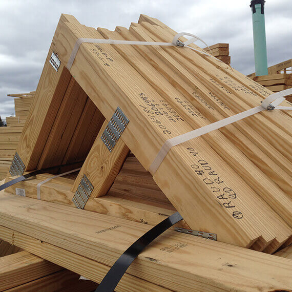 a stack of pre-constructed roof rafters