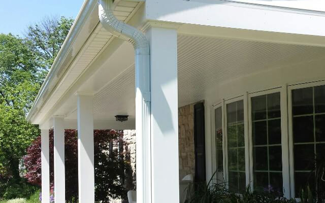white seamless rain gutters, azek fascia board and pvc exterior trim on front porch