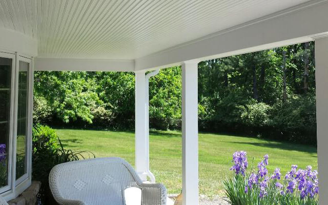 white exterior trim and beam cap porch posts.