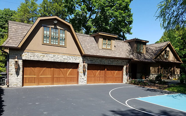 light brown grand manor shingles and copper roof on residential home